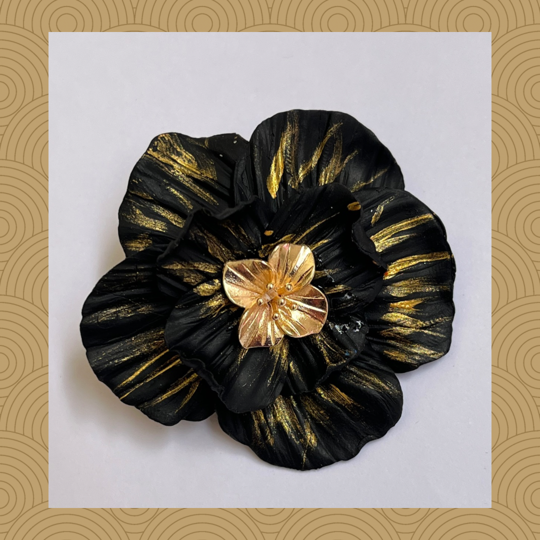 Prendedor negro dorado